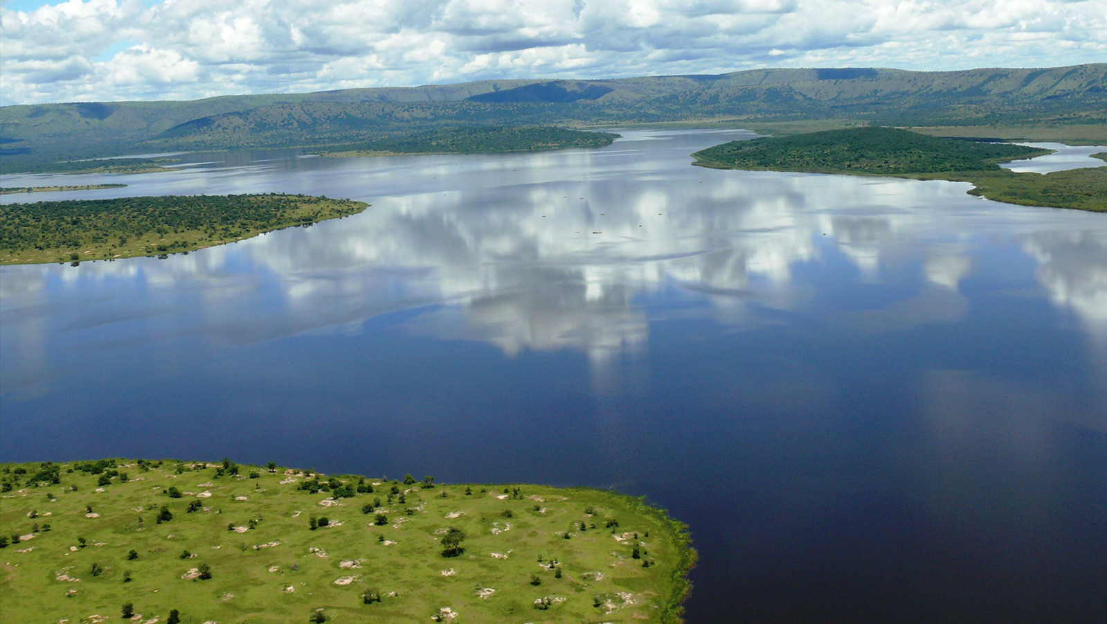 Aerial view of Lake Ihema with patches of green vegetation 
