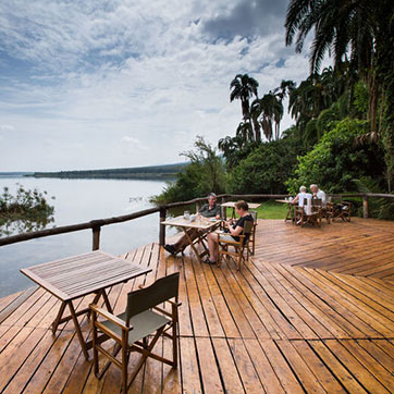 Sitting area on a deck overlooking a lake in Akagera National Park