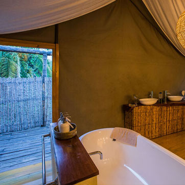 Bathroom with Tub and sinks inside a tent